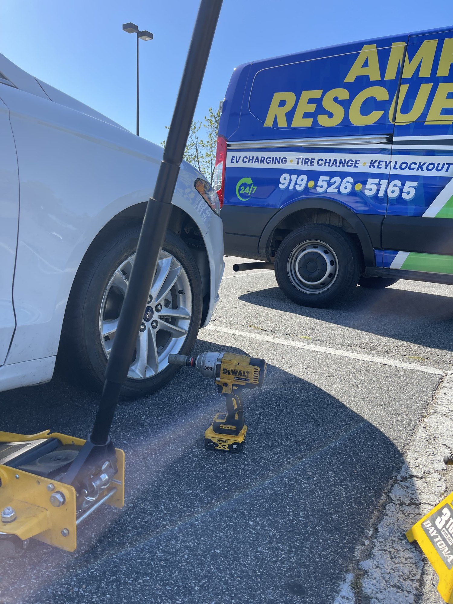 Amp Rescue providing mobile tire service in a parking area