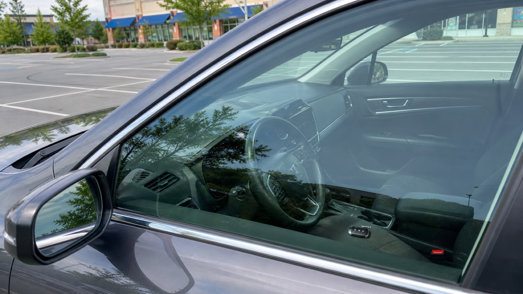Car keys visible inside a locked vehicle in a Raleigh parking lot